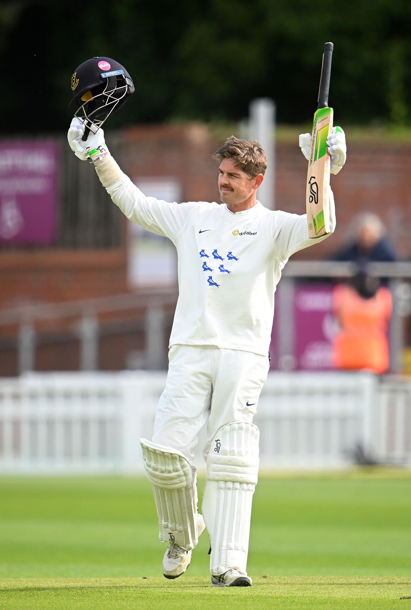 Hughes stays fluent as Sussex pray for rain