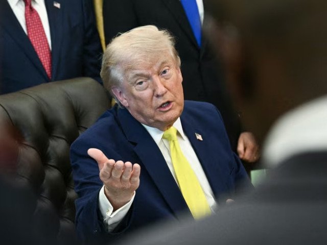 Trump vows response after Iran downs US copter