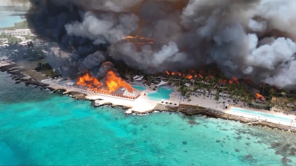At least one tourist dead after massive fire nearly destroys Caribbean resort; 1,690 evacuated